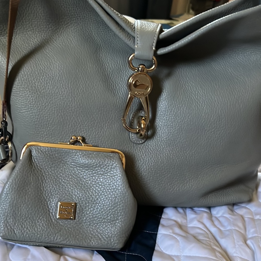 NWOT. Soft pebble leather. Never used. Comes with coin purse and key fob